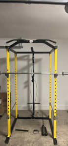 Squat rack with cables and pull up bar
