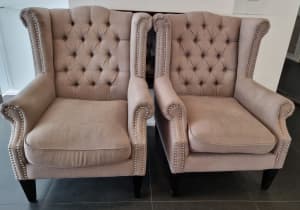 2 x medium grey studded armchairs 