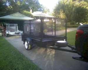 8 x 5 Trailer. New. Full Cage. H.D. Tailgate/Ramp with Spring Assist.