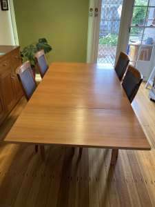 Extendable timber dining table. Seats 4-8.