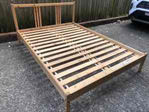 IKEA timber double bed frame with solid timber slats