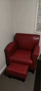 Red leather lounge chair and foot rest