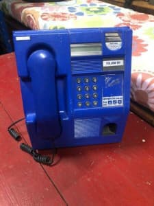 Retro vintage blue pay phone for man cave display