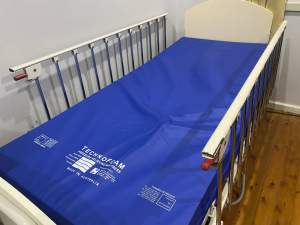 Electric hi low bed with remote control and side rails
