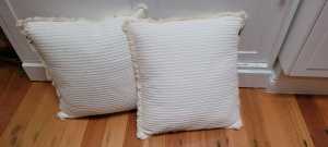 2 new cream cushions