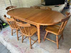 Solid timber extension dining table and six Spindleback dining chairs