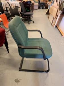 Green and orange patterned office armchair