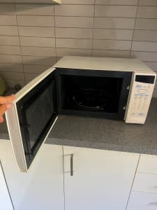 Small microwave along with all the pots, pans, cutlery etc
