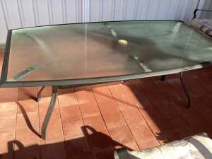 Glass top outdoor table. Setting for 6.