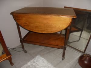 ANTIQUE SOLID TIMBER DROP SIDE TABLE ON CASTERS