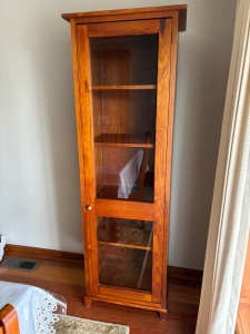 Solid timber glass display cabinet.
