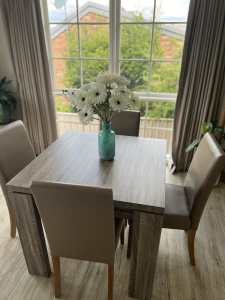 Square dining table with chairs.