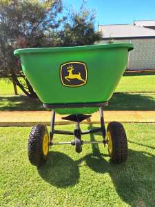 JOHN DEERE tow behind fertilizer/seed spreader for ride on mowers.