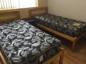 2 Single bed frames with mattresses and queen mattress