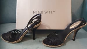 Nine West high heeled, black and snake, open, strap style.