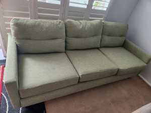 Second hand used green 3 seater sofa