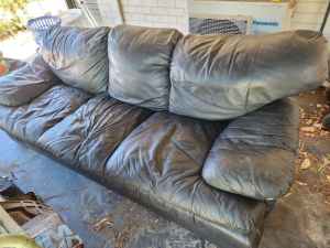 Black leather sofa/couch/lounge needs cleaning