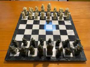 Marble stone chess board with carved asian figurines