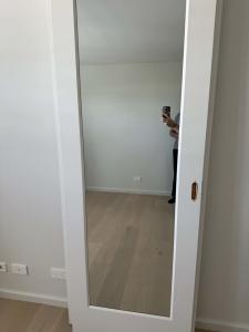 Brand new white wooden framed mirrored, sliding wardrobe doors
