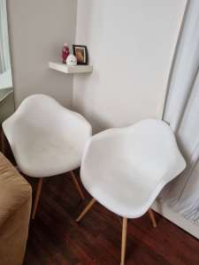 Four replica Eames chairs