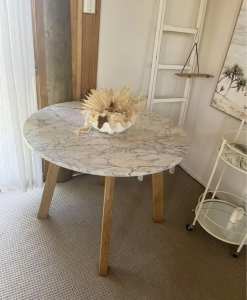 Opulence Solid Marble Round Dining Table with cleaning products 