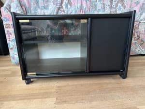 Black cabinet with one glass and one timber door