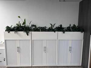 3x white credenzas with planter boxes
