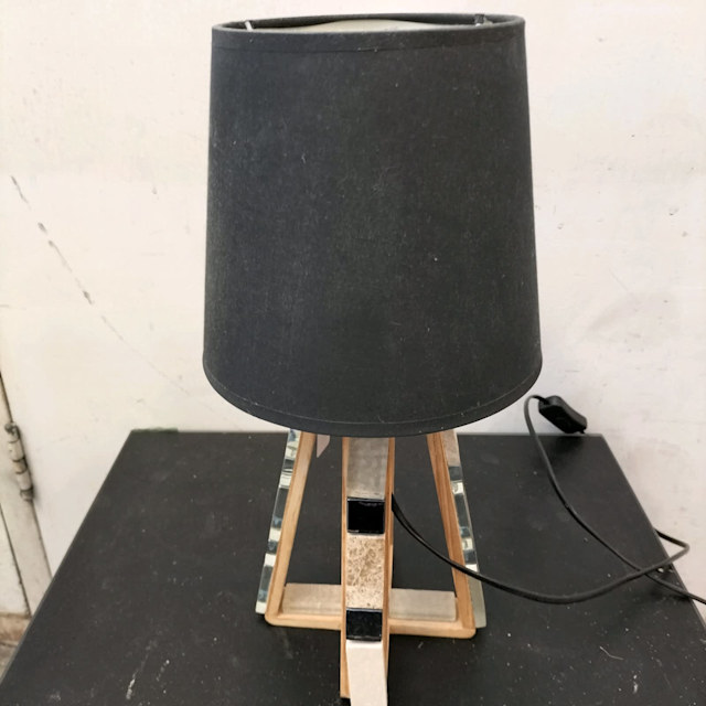 Modern quad timber table lamp with black ceramic accents. Table