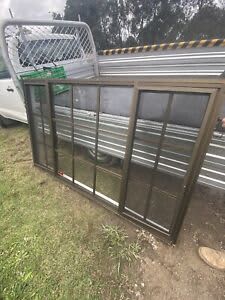 Bronze aluminium double sliding colonial style window with screens ...