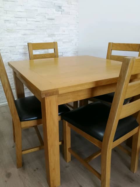 next oak table and 4 chairs