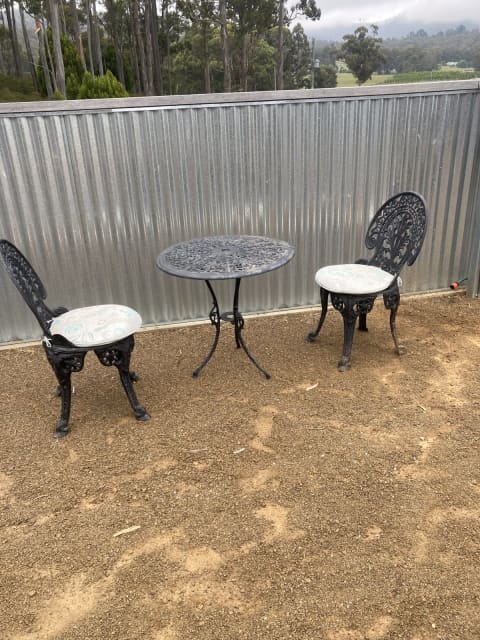 used cast iron table and chairs