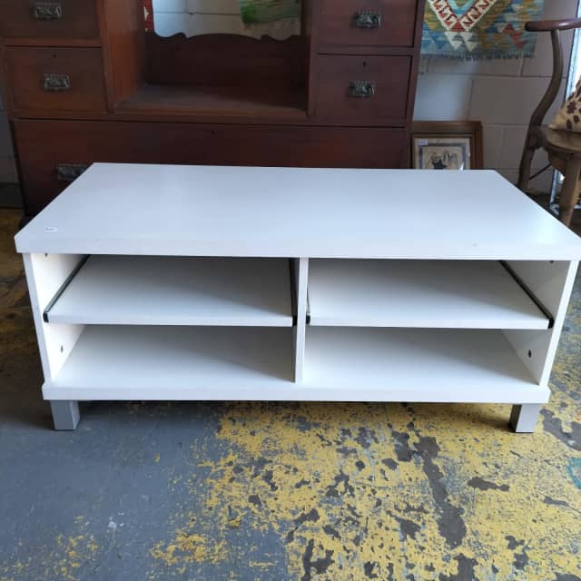 Small white laminated TV/ entertainment unit with slide out shelves