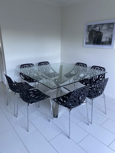 8 seater black glass dining table