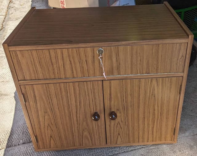 Faux teak 2 door TV unit craft storage drinks cupboard on wheels