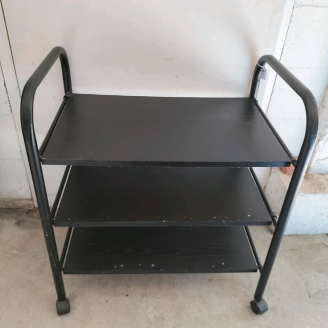 Rolling black metal and laminate storage unit with removable shelves