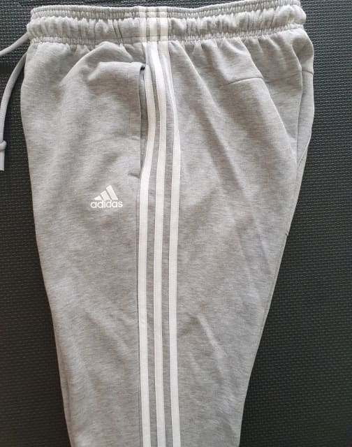 grey and white adidas tracksuit