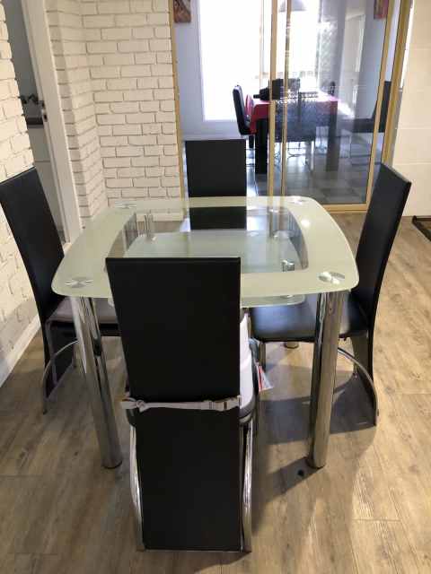 small glass dining table and 4 chairs