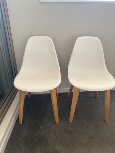 white plastic bucket dining chairs