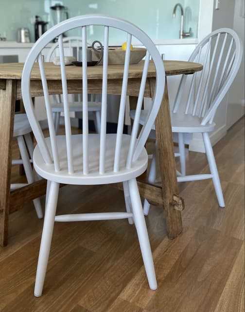 set of four wooden dining chairs