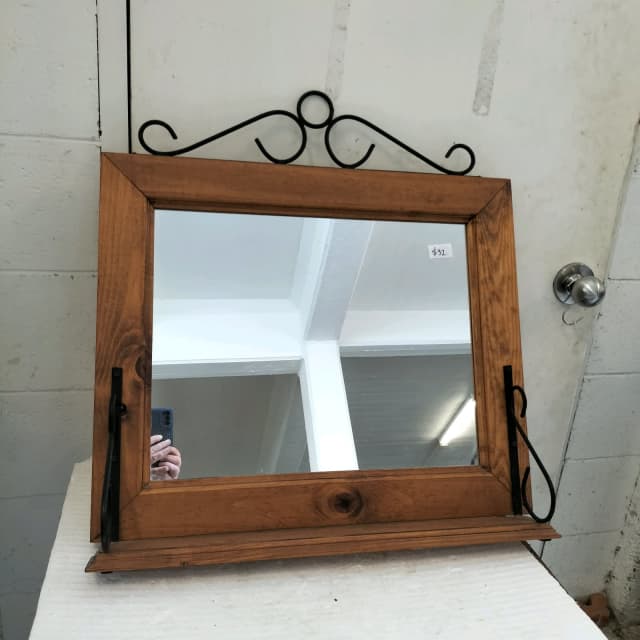 Timber and metalwork scroll wall mirror with shelf. Mirrors in