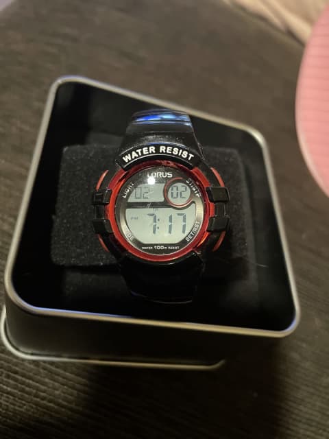 Lorus digital watch in tin. Exc condition new battery. Watches