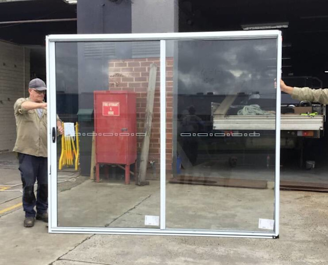 2100H X 2410W PEARL WHITE ALUMINIUM SLIDING DOOR. IN STOCK NOW