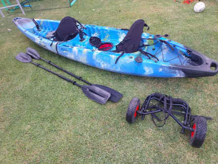 two person fishing kayak with paddles and trolley