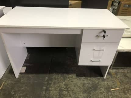 assembled desk with drawers