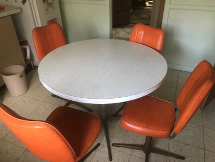 round table with 4 swivel chairs