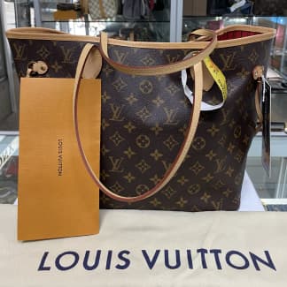 Brown louis vuitton backpack hi-res stock photography and images