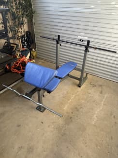 Bench press and barbell with preacher curl attachment and curl bar