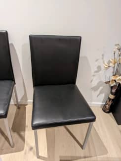 6 black leather chairs