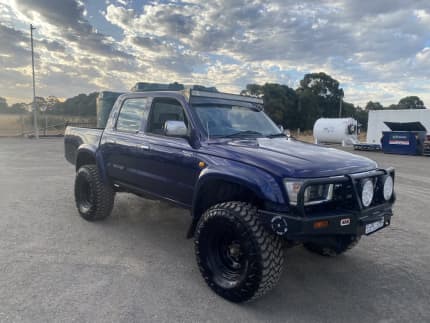 1999 maroon toyota hilux 4x4 pickup