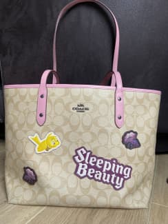 Coach sleeping 2024 beauty tote